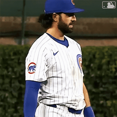 A Baseball Player Wearing A Chicago Cubs Uniform Is Standing On The Field GIF