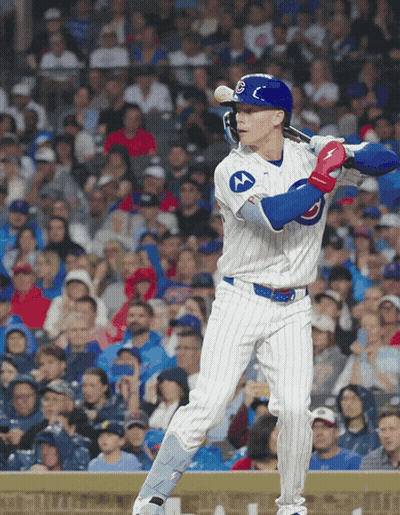A Baseball Player Wearing A Chicago Cubs Uniform Swings His Bat GIF