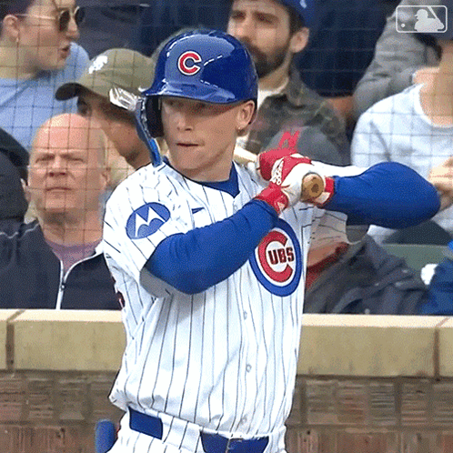 A Baseball Player Wearing A Cubs Uniform Holds A Bat GIF