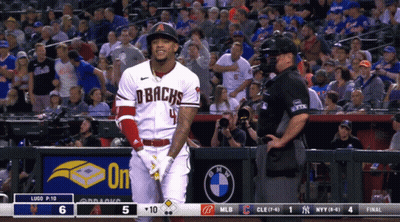 A Baseball Player Wearing A Dbacks Jersey Stands In Front Of A Crowd GIF