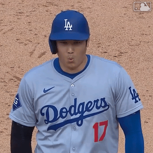 A Baseball Player Wearing A Dodgers Jersey Is Making A Face GIF