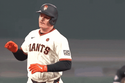 A Baseball Player Wearing A Giants Jersey Waves His Hand GIF