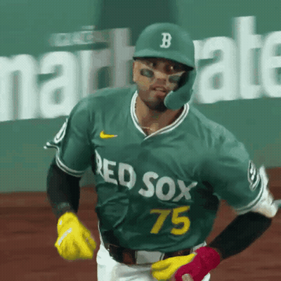 A Baseball Player Wearing A Green Jersey That Says Red Sox 75 On It GIF