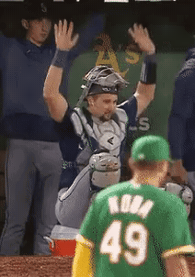 A Baseball Player Wearing A Green Jersey With The Number 49 GIF
