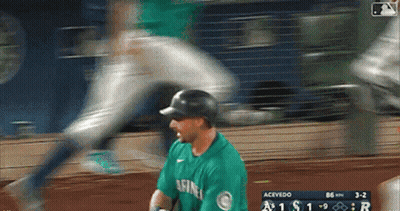 A Baseball Player Wearing A Green Seahawks Jersey GIF