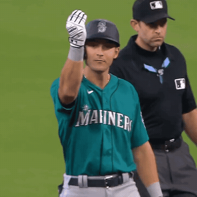 A Baseball Player Wearing A Green Shirt That Says Manners GIF