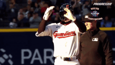 A Baseball Player Wearing A Guardians Uniform Stands On The Field GIF