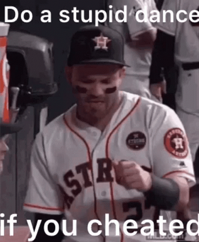 A Baseball Player Wearing A Hat And A Jersey With The Words `` Do A Stupid Dance If You Cheated '' Written On It . GIF