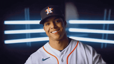 A Baseball Player Wearing A Hat With The Letter H On It Smiles GIF