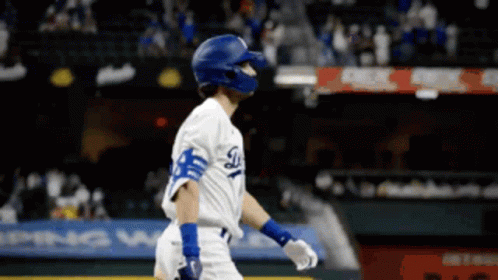 A Baseball Player Wearing A Helmet And A Dodgers Uniform GIF