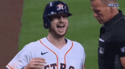 A Baseball Player Wearing A Helmet And A Jersey That Says Astros GIF