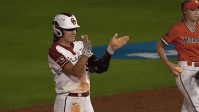 A Baseball Player Wearing A Helmet And Knee Pads With The Letter B On It GIF