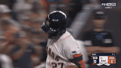A Baseball Player Wearing A Helmet And Number 27 On His Jersey GIF
