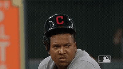 A Baseball Player Wearing A Helmet With A C On It GIF