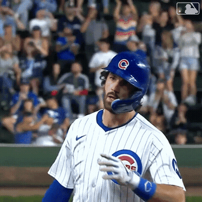A Baseball Player Wearing A Helmet With The Letter C On It Is Standing On The Field . GIF