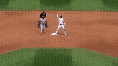 A Baseball Player Wearing A Jersey That Says Angels On It GIF