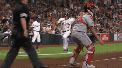 A Baseball Player Wearing A Jersey That Says Astros Is Running Towards The Base GIF