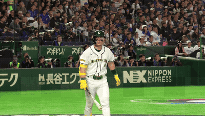 A Baseball Player Wearing A Jersey That Says Australia Holds A Bat GIF