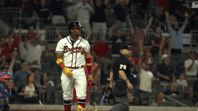 A Baseball Player Wearing A Jersey That Says Braves GIF
