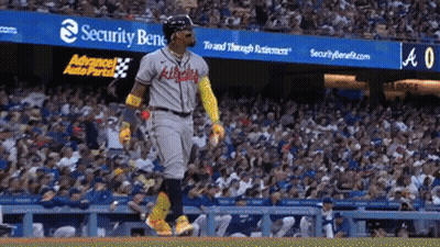 A Baseball Player Wearing A Jersey That Says Braves Is Running Towards The Dugout GIF