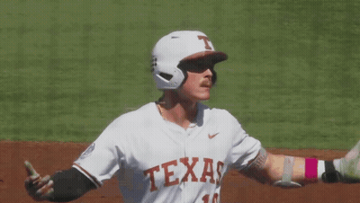 A Baseball Player Wearing A Jersey That Says " Texas " On It GIF