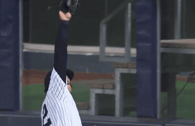 A Baseball Player Wearing A Jersey With The Number 12 On It GIF