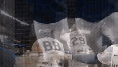 A Baseball Player Wearing A Jersey With The Number 29 On The Back GIF