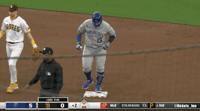 A Baseball Player Wearing A Kansas City Jersey Walks Towards The Base GIF