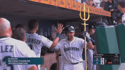 A Baseball Player Wearing A Mariners Jersey High Fives His Teammates GIF