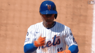 A Baseball Player Wearing A Mets Jersey And Helmet GIF
