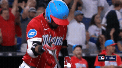 A Baseball Player Wearing A Miami Jersey Holds His Bat GIF