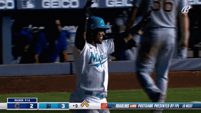 A Baseball Player Wearing A Miami Jersey Is Celebrating GIF