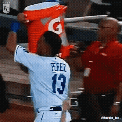 A Baseball Player Wearing A Number 13 Jersey Is Holding A Gatorade Bucket Over His Head GIF