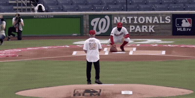 A Baseball Player Wearing A Number 19 Jersey Stands On The Mound GIF