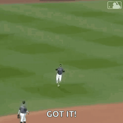 A Baseball Player Wearing A Nyc Jersey Is Walking On A Field . GIF