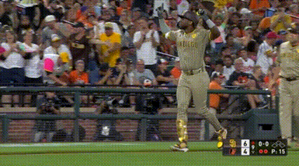 A Baseball Player Wearing A Oakland Uniform Is Running On The Field . GIF