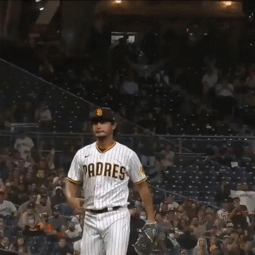 A Baseball Player Wearing A Padres Jersey Celebrates A Win GIF