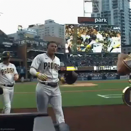 A Baseball Player Wearing A Padres Uniform Runs On The Field GIF
