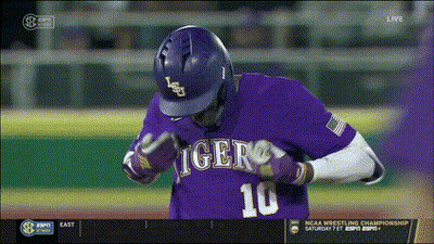 A Baseball Player Wearing A Purple Jersey With The Number 10 GIF