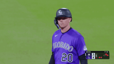 A Baseball Player Wearing A Purple Uniform With Colorado 20 On It GIF