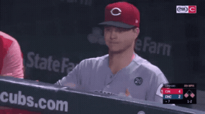 A Baseball Player Wearing A Red Cubs Hat GIF