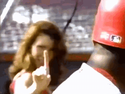 A Baseball Player Wearing A Red Hat With A Mlb Logo GIF
