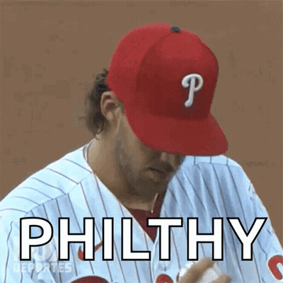 A Baseball Player Wearing A Red Hat With The Letter P On It GIF
