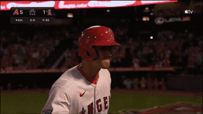 A Baseball Player Wearing A Red Helmet With The Word Angels On It GIF