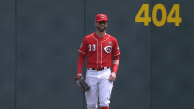 A Baseball Player Wearing A Red Jersey With The Number 33 GIF