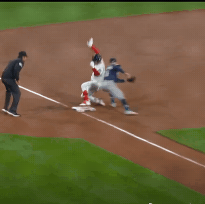A Baseball Player Wearing A Red Sox Jersey Is Standing On The Field GIF