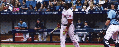 A Baseball Player Wearing A Red Sox Uniform Stands In Front Of A Dugout GIF