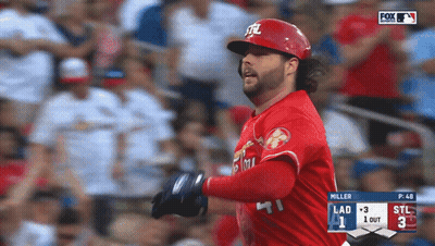 A Baseball Player Wearing A Red Uniform With The Letters Stl On It GIF
