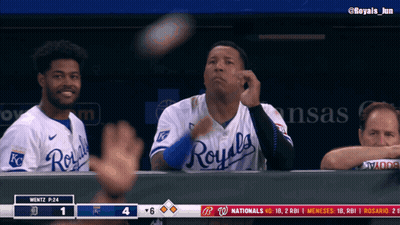A Baseball Player Wearing A Royals Jersey Throws A Ball In The Air GIF