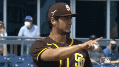 A Baseball Player Wearing A San Diego Padres Uniform Is Pointing GIF